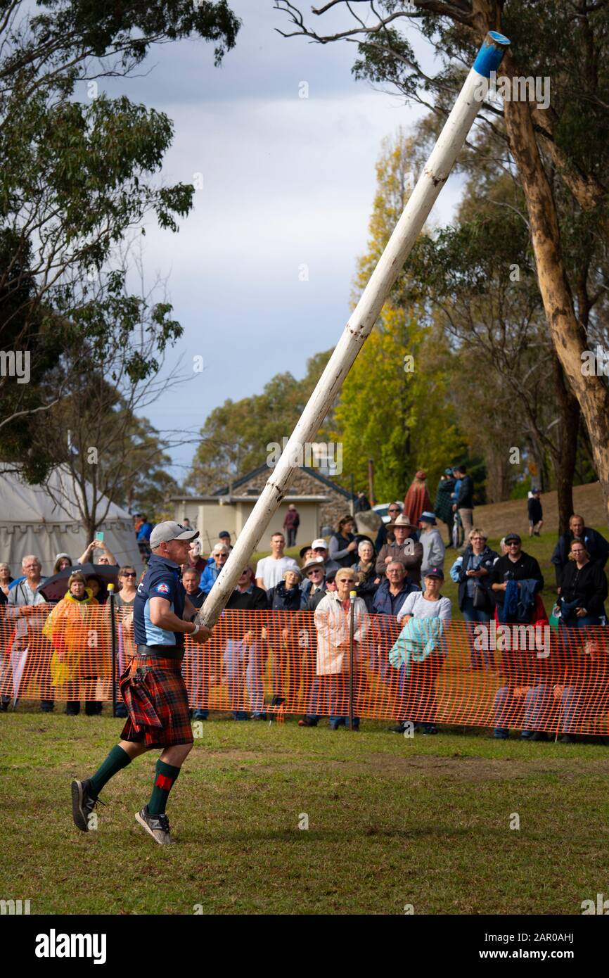 Tossing the Caber at Highland Games, Glen Innes Celtic Festival NSW Stock Photo