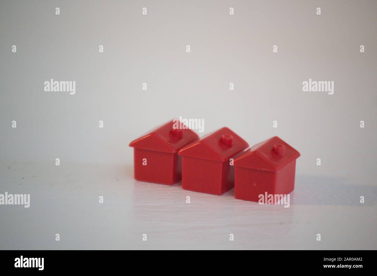 Monopoly Houses concept, white background Stock Photo