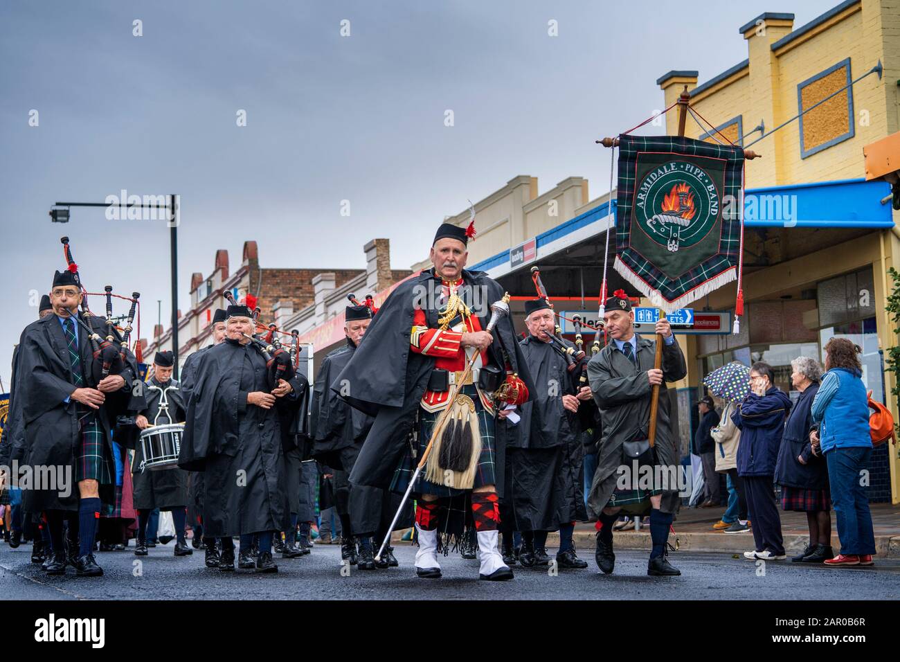 Scottish Pipe band in rain wear during opening parade of the Glen Innes