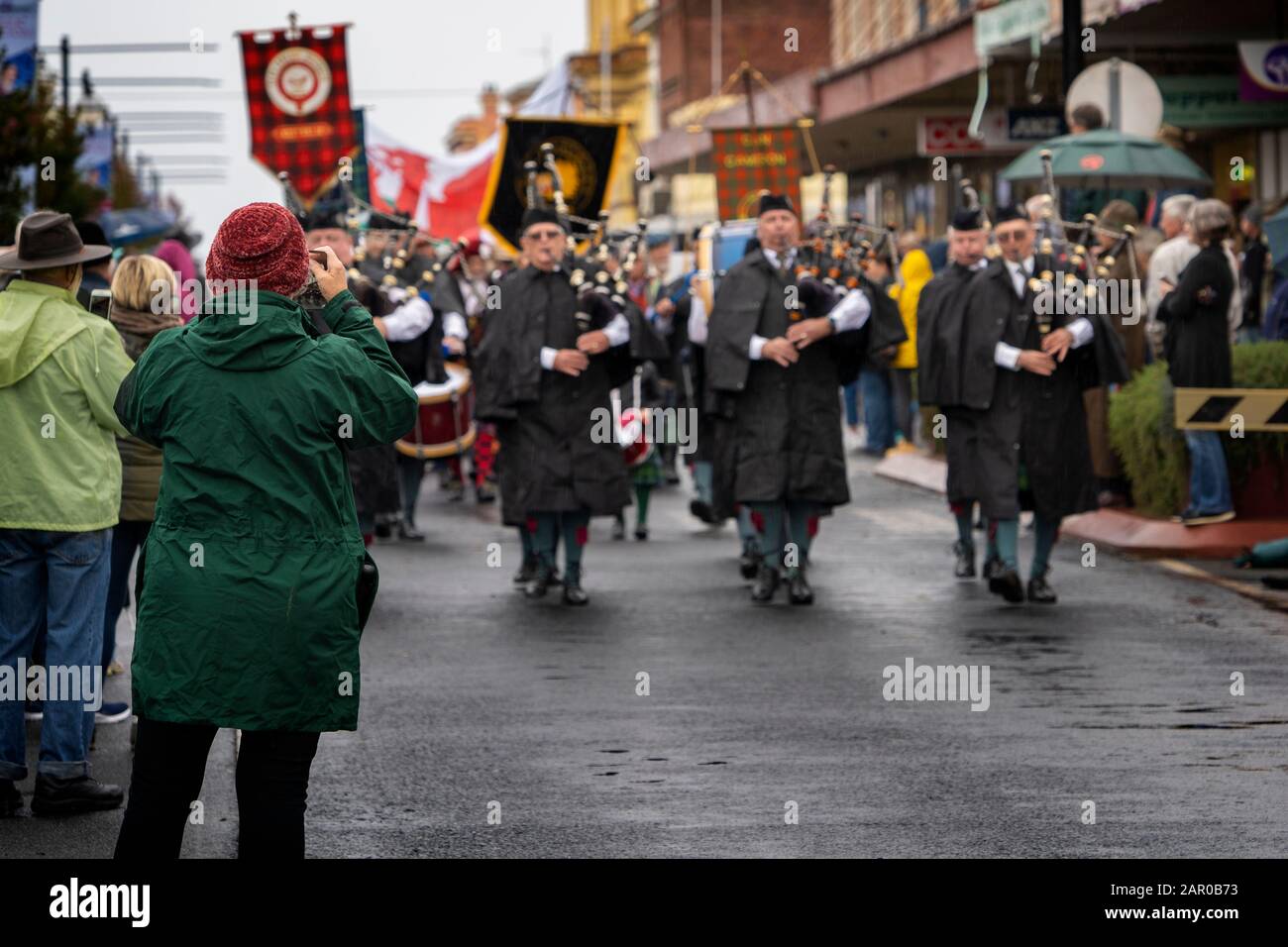 Scottish Pipe band in rain wear during opening parade of the Glen Innes