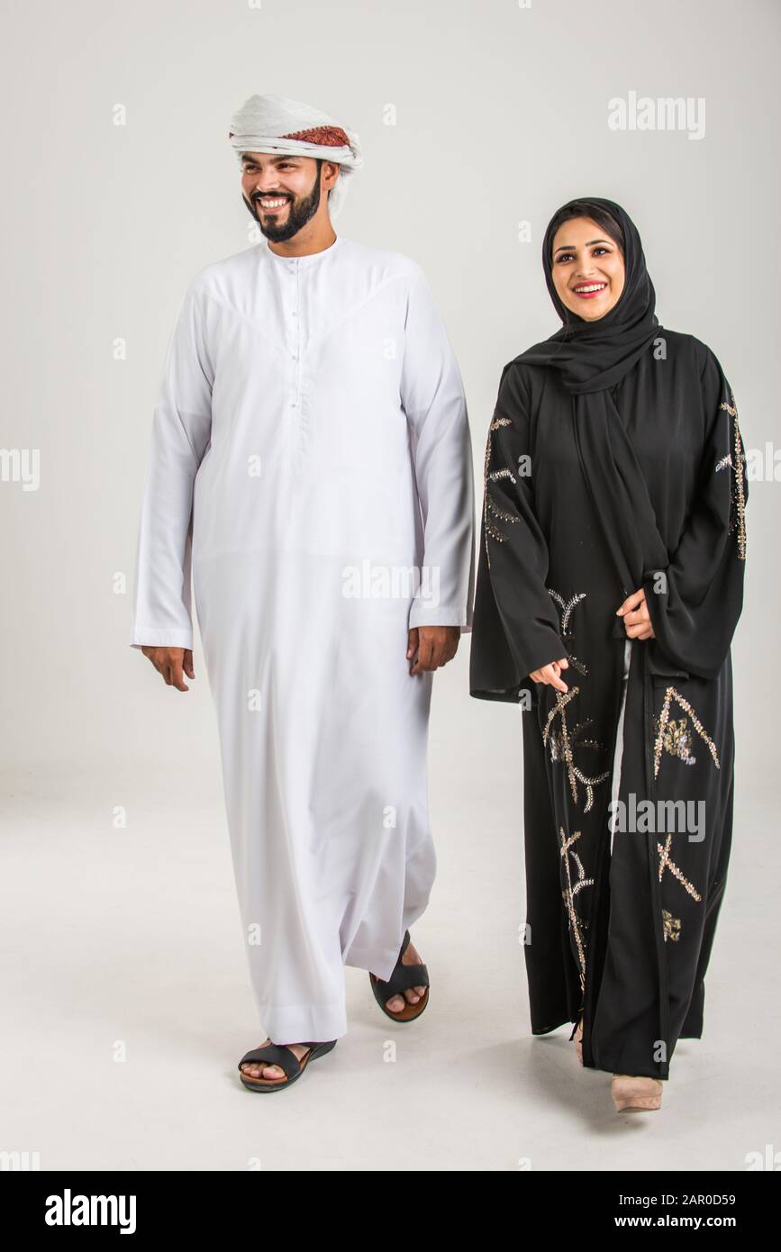 Middle eastern family with traditional emirates dresses posing in a  photographic studio - Concepts about lifestyle, happiness and family  relationship Stock Photo - Alamy