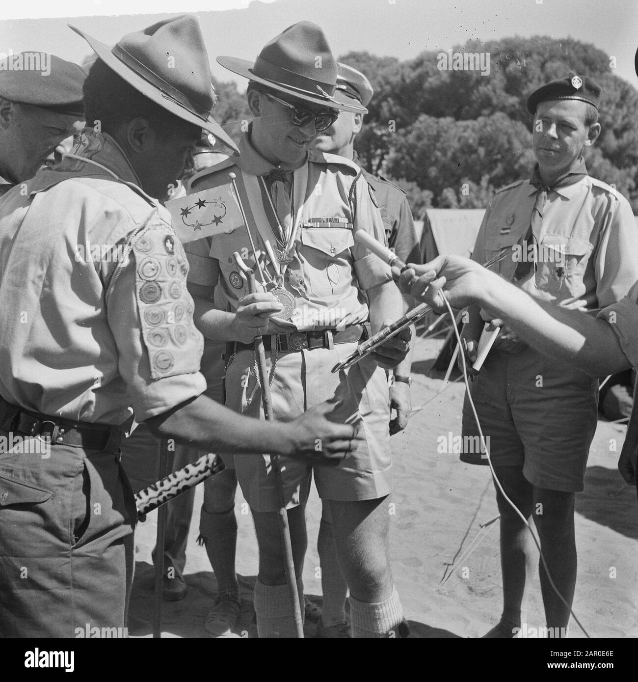 Jamboree 1963 at Marathon Greece. The only Surinamer in the camp gave the prince an article of his country Date: 12 August 1963 Location: Greece Keywords: COUNTRIES, camps, princes Institution name: Jamboree Stock Photo