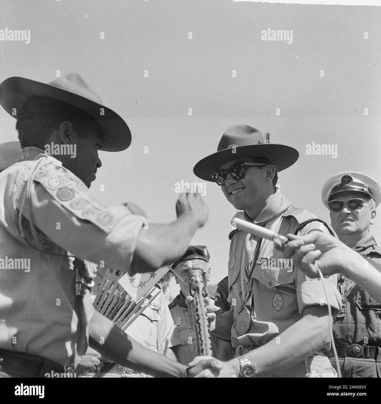 Jamboree 1963 at Marathon Greece. The only Surinamer in the camp gave the prince an article of his country Date: 12 August 1963 Location: Greece Keywords: camps, princes Institution name: Jamboree Stock Photo
