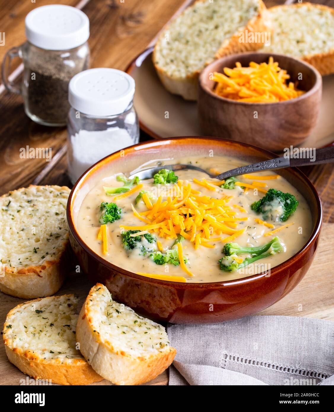 Bowl Of Creamy Broccoli Cheddar Soup With Toasted Cheese Bread On A Wooden Table Stock Photo Alamy
