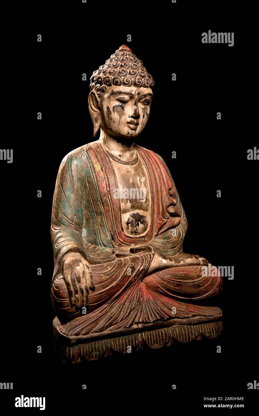 Colorful painted Buddha statue sitting in the lotus position for inner