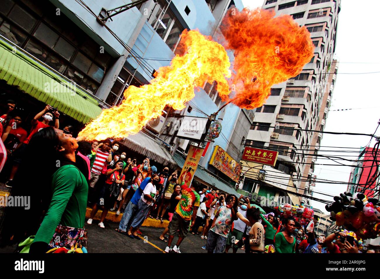 Binondo, Philippines. 25th Jan, 2020. A tribal dancers performed their act as a human torch in various streets of Binondo during the celebration of year of the rat Chinese New Year in Binondo (The oldest China Town in the world) Manila City on January 25, 2020. (Photo by Gregorio B. Dantes Jr./Pacific Press) Credit: Pacific Press Agency/Alamy Live News Stock Photo