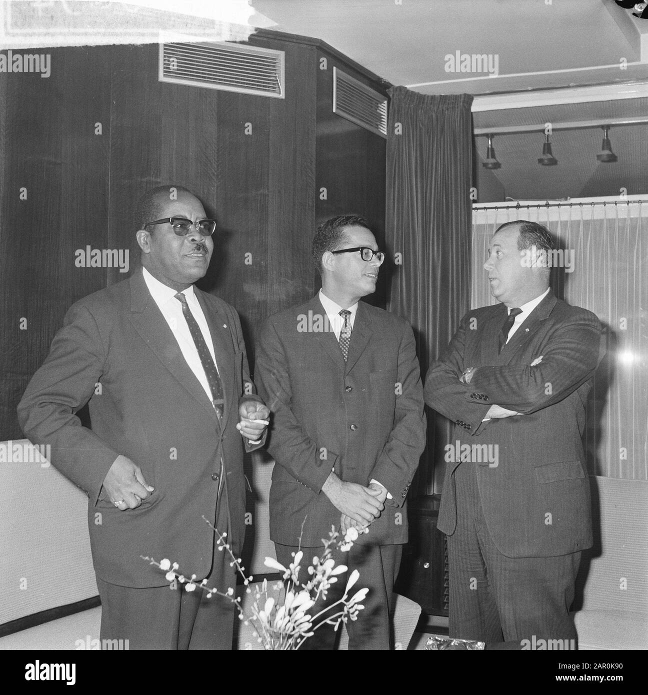 Leading persons of the Netherlands Antilles from Tel Aviv at Schiphol Airport, from l.n.r. Minister E. O. Petronia F. J. Tromp and I. S. Henriques Date: 25 February 1964 Location: Noord-Holland, Schiphol Personal name: F. J. Tromp, I. S. Henriques Stock Photo