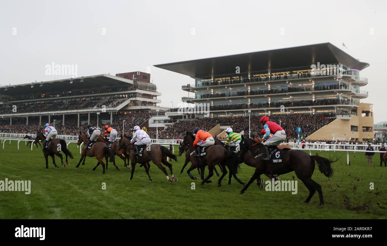 The field passes the grandstands in the Timeform Novices' Handicap Chase during Festival Trials Day at Cheltenham Racecourse. Stock Photo
