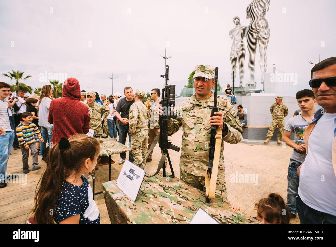 Batumi, Adjara, Georgia - May 26, 2016: Soldier holding M4 assault rifle at an exhibition of weapons during celebration of the national holiday - the Stock Photo