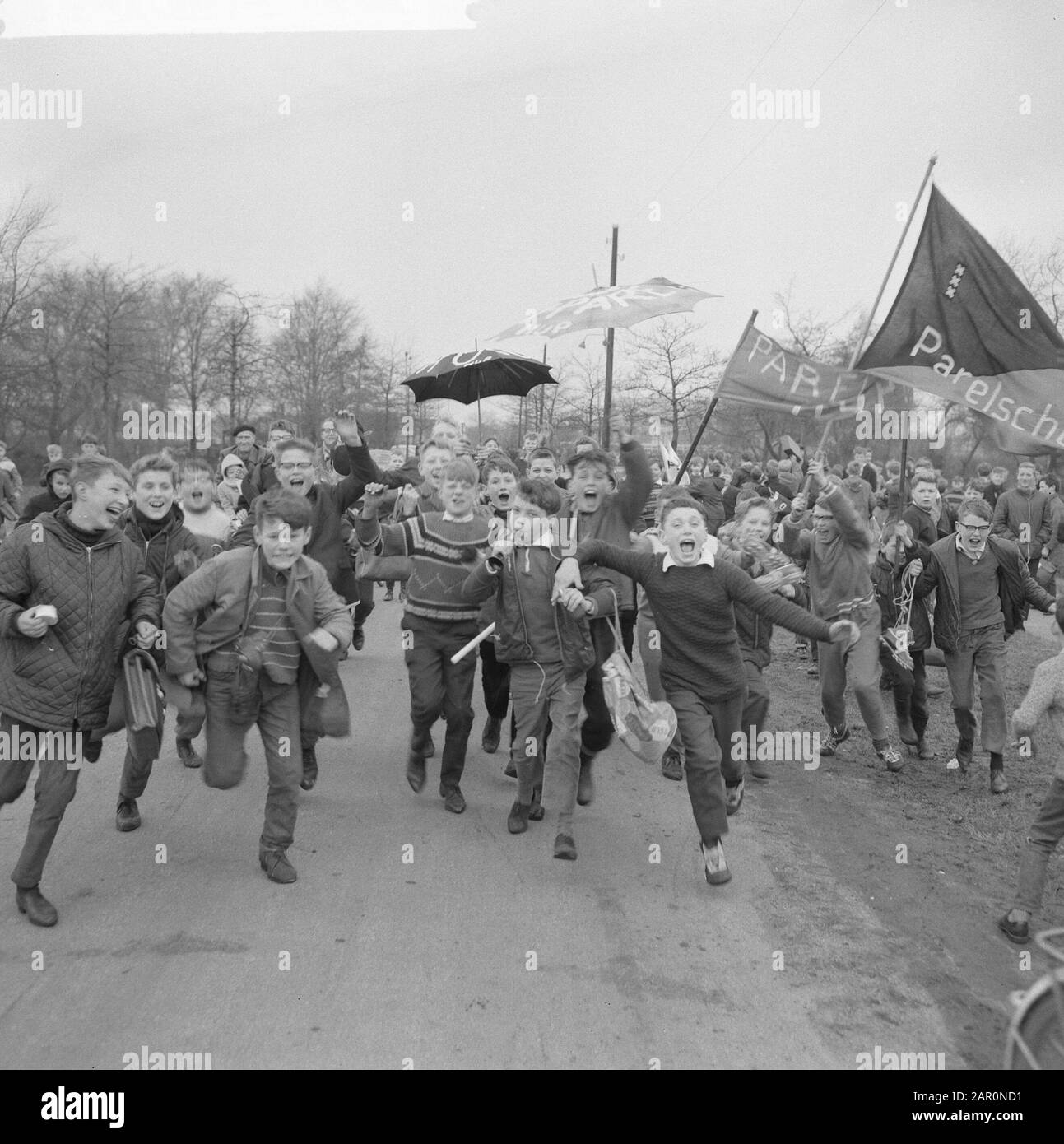 Large annual school football tournament started Annotation: The children wear banners with inscription Hup pearl-schooll Date: March 25, 1964 Keywords: sport, football tournaments Stock Photo