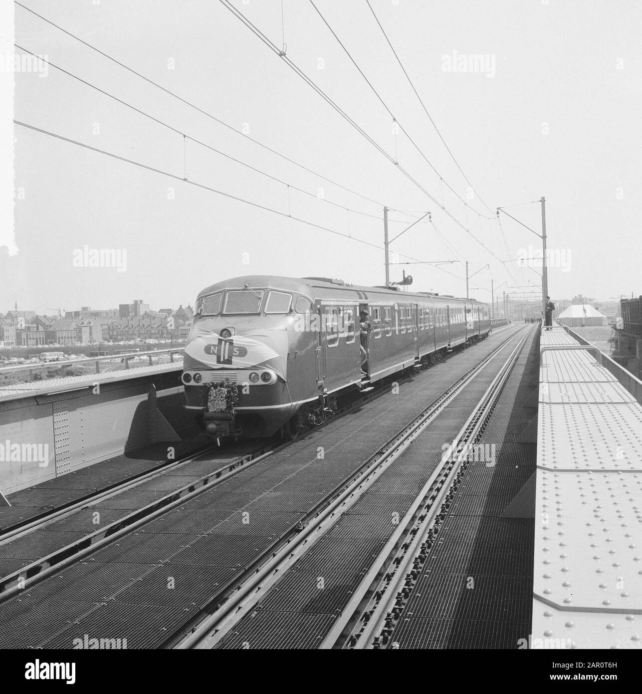 New railburg over the Meuse near Venlo put into operation a train with invited guests over the bridge Date: 23 May 1964 Location: Meuse, Venlo Keywords: invitees, railway bridges, trains Stock Photo