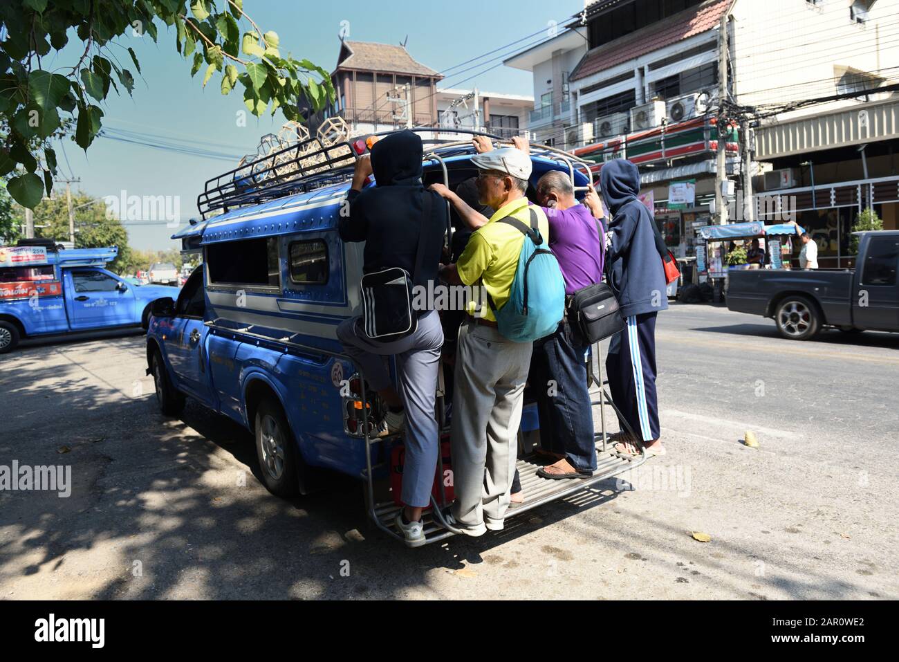 Standing room only for passengers on the back of a songthaew, Chiang Mai, Thailand Stock Photo