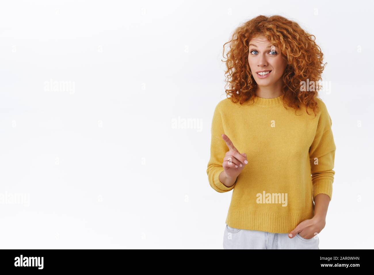 Unsure, redhead girl give advice, warn you something is not really good, shaking index finger and grimacing hesitant, have suggestion or worry, saying Stock Photo