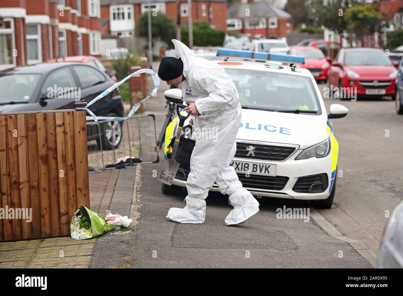 Forensics officers at the scene of a fire at a house on Wensley Avenue, Hull, where two people have died, including an eight-year-old. Stock Photo