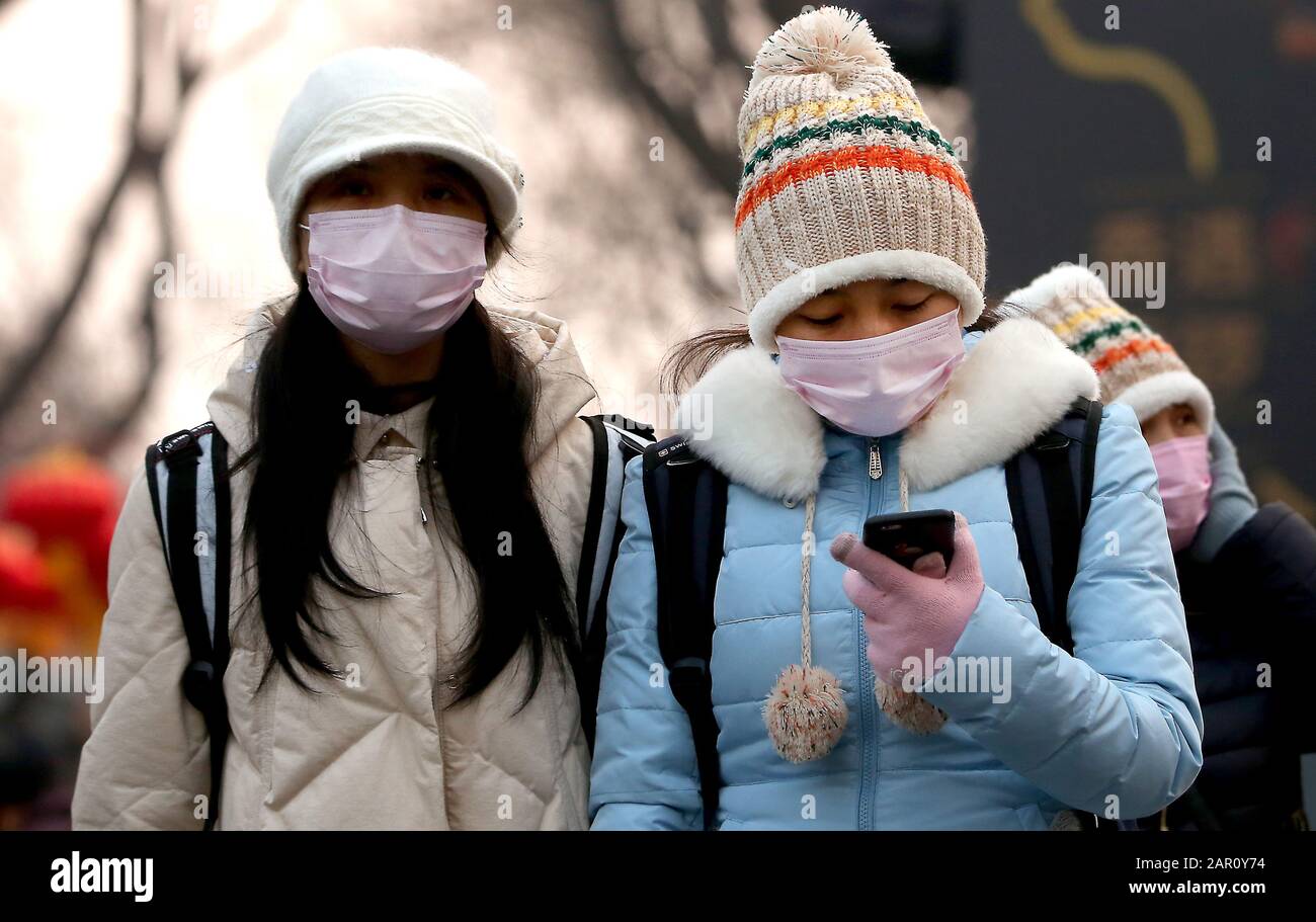 Beijing, China. 25th Jan, 2020. Chinese wear protective respiratory masks in Beijing on Saturday, January 25, 2020. All major Chinese New Year events have been cancelled in China's capital, along with all other large-scale activities in a bid to prevent the spread of the coronavirus. China virus death toll has hit 41. Photo by Stephen Shaver/UPI Credit: UPI/Alamy Live News Stock Photo