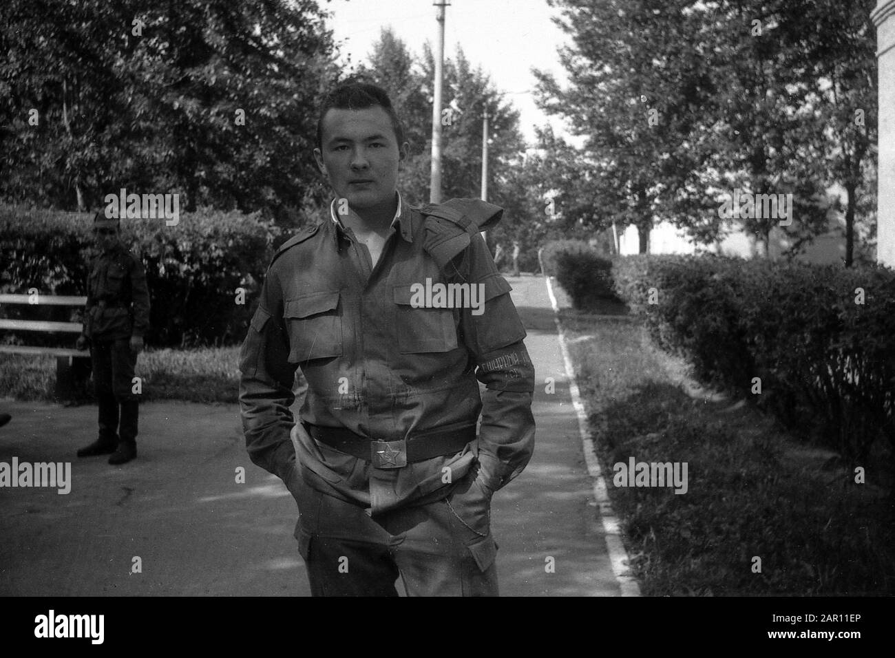 STUPINO, MOSCOW REGION, RUSSIA - CIRCA 1992: The portrait of soldier of the Russian army. Black and white. Film scan. Large grain. Stock Photo