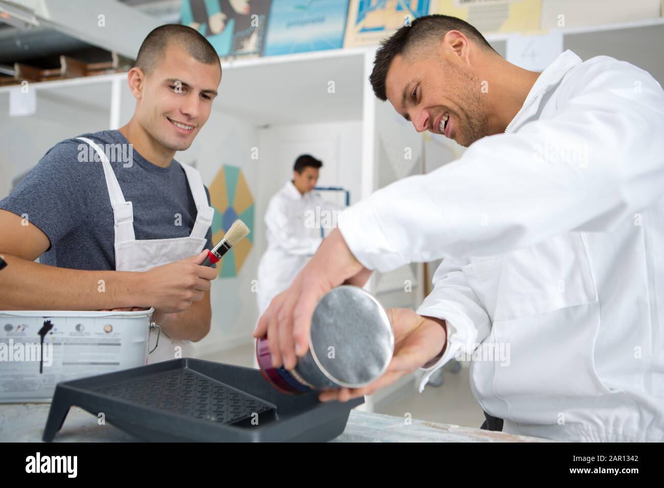 a painter with an apprentice Stock Photo