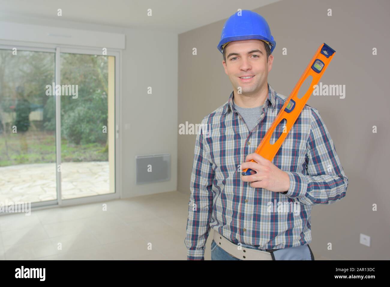 Builder Using Level constructor and professional builder with spirit level at site Stock ...
