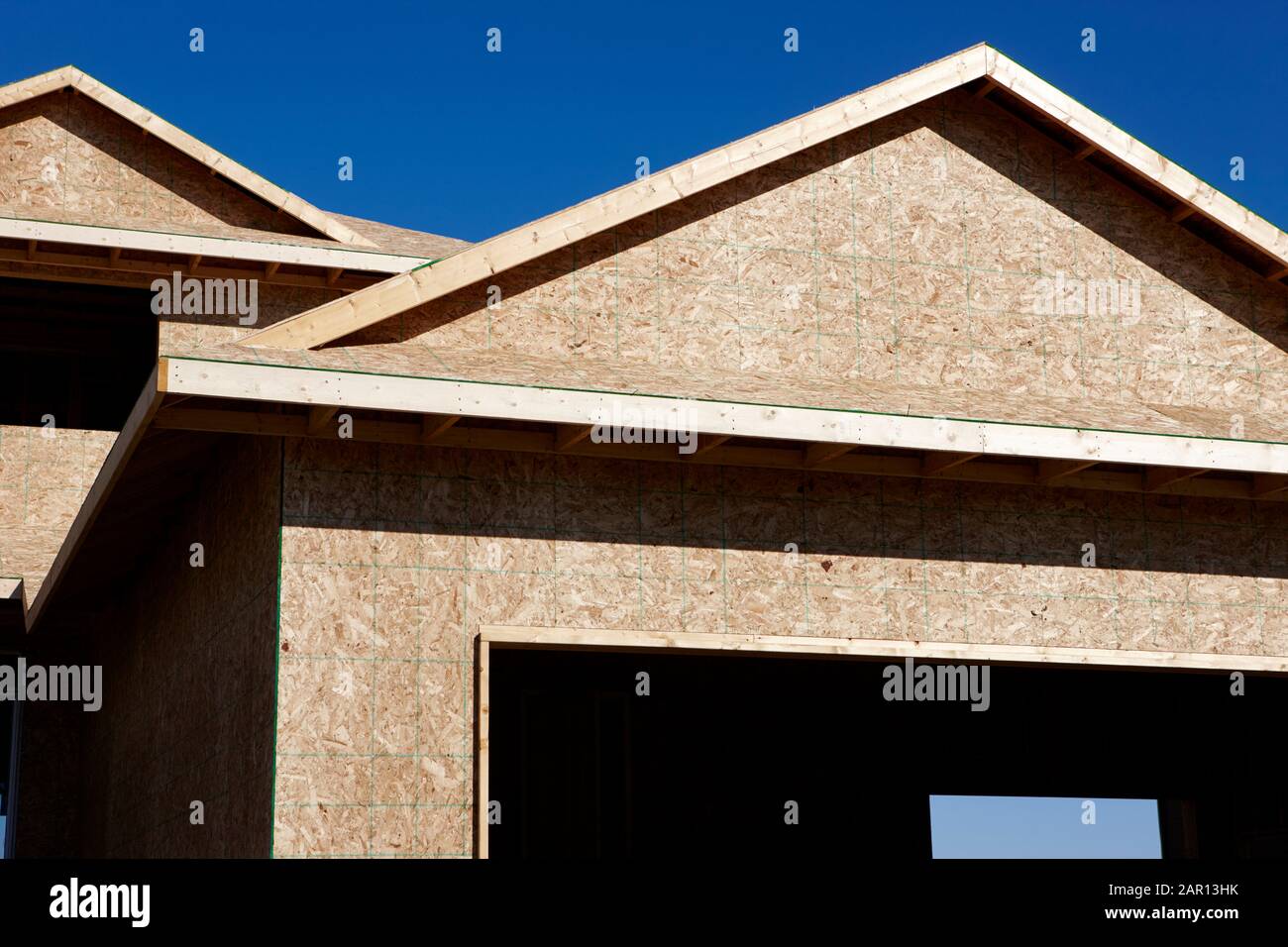 timber framed house under construction in canada Stock Photo