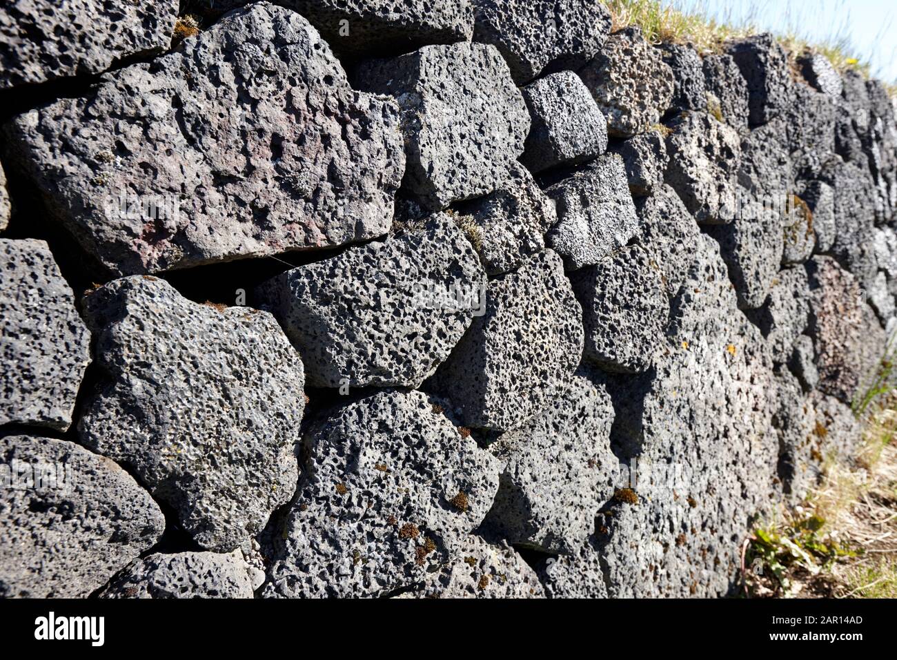 dry stone wall made of volcanic rocks iceland Stock Photo