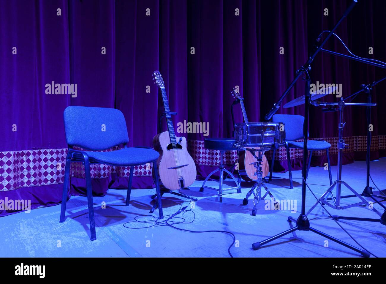 acoustic guitar, drum, microphone and stage chair Stock Photo Alamy