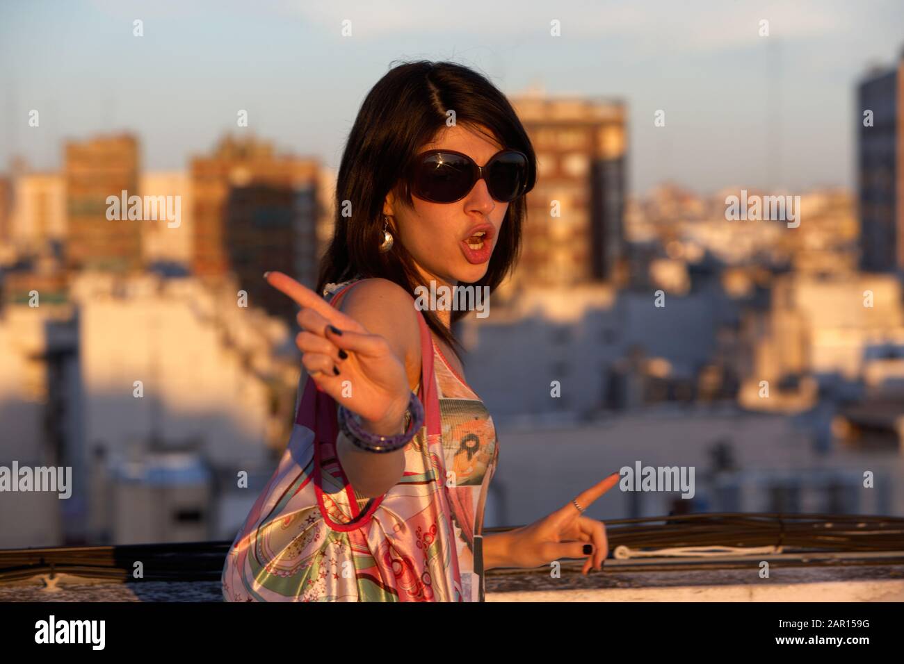 young woman waving finger at camera in buenos aires argentina  Model released image Stock Photo