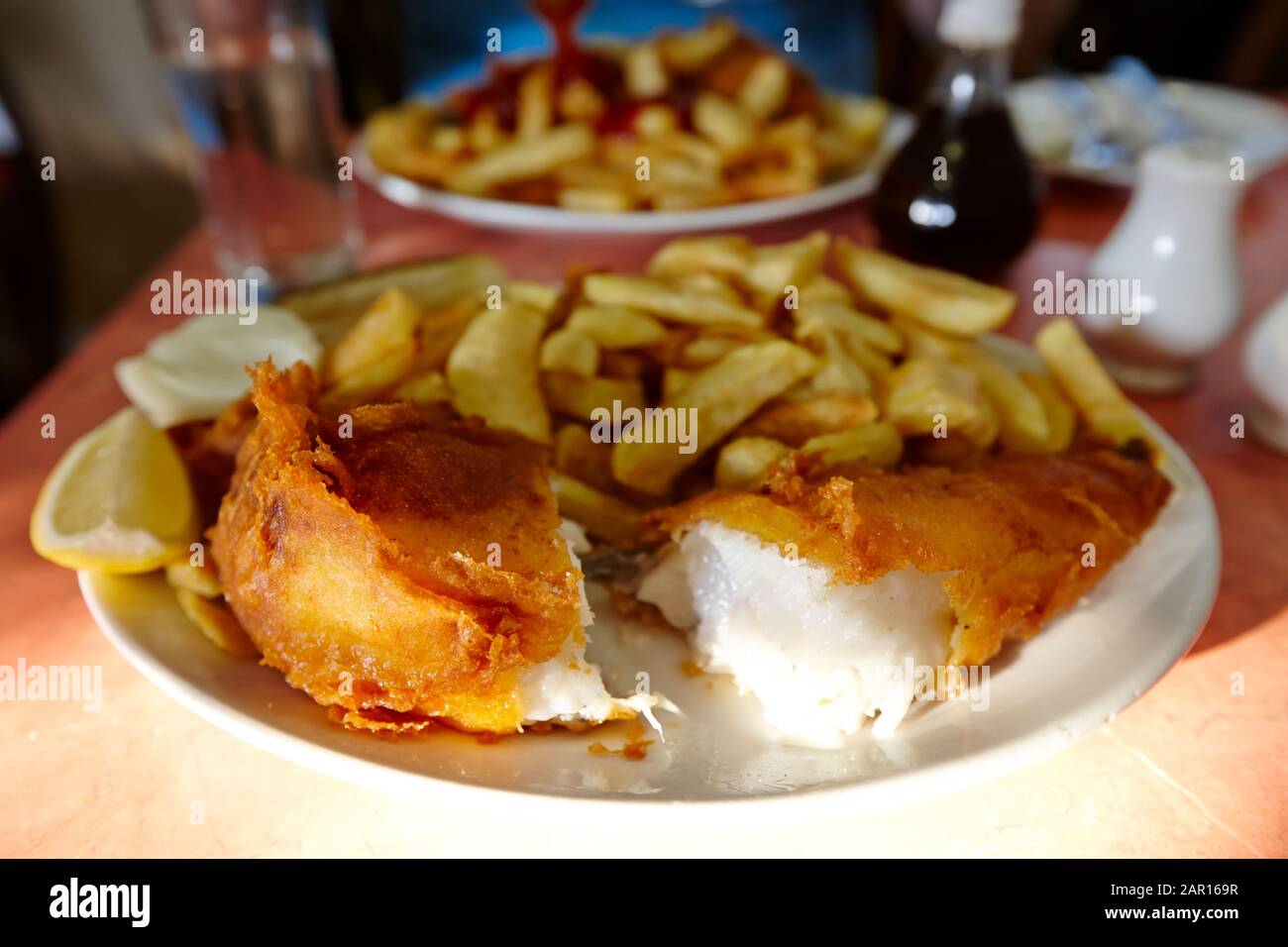 fish and chips in a restaurant cafe in London Stock Photo Alamy