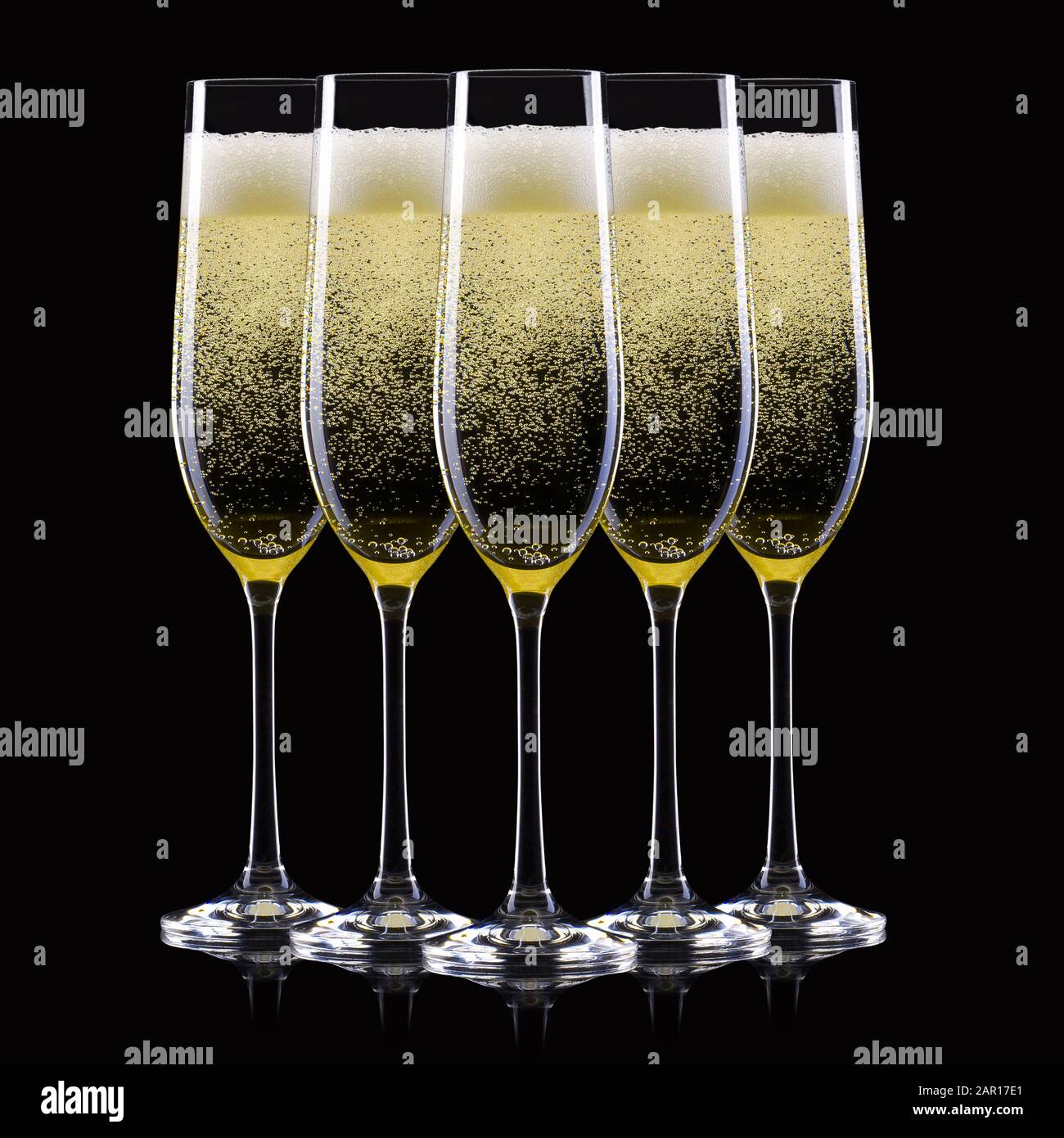 Set of luxury champagne glasses in a row isolated on a black background