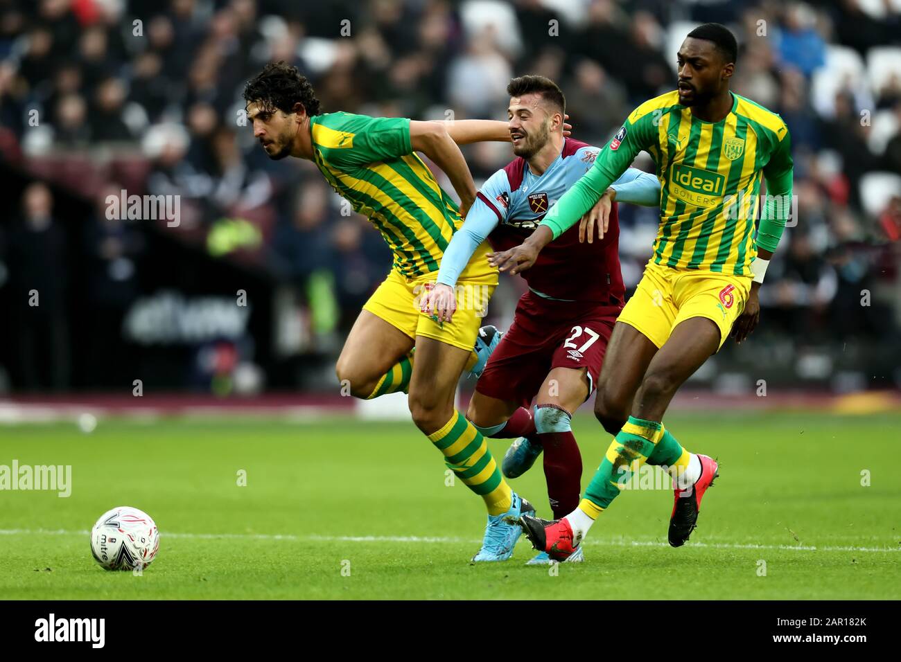 London Stadium, London, UK. 25th January 2020; London Stadium, London, England; English FA Cup Football, West Ham United versus West Bromwich Albion; Ahmed Hegazy and Semi Ajayi of West Bromwich Albion close down Albian Ajeti of West Ham United - Strictly Editorial Use Only. No use with unauthorized audio, video, data, fixture lists, club/league logos or 'live' services. Online in-match use limited to 120 images, no video emulation. No use in betting, games or single club/league/player publications Stock Photo