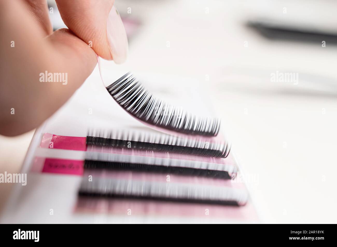 Eyelash Extension tools on white background. Accessories for eyelash extensions. Artificial lashes. Stock Photo