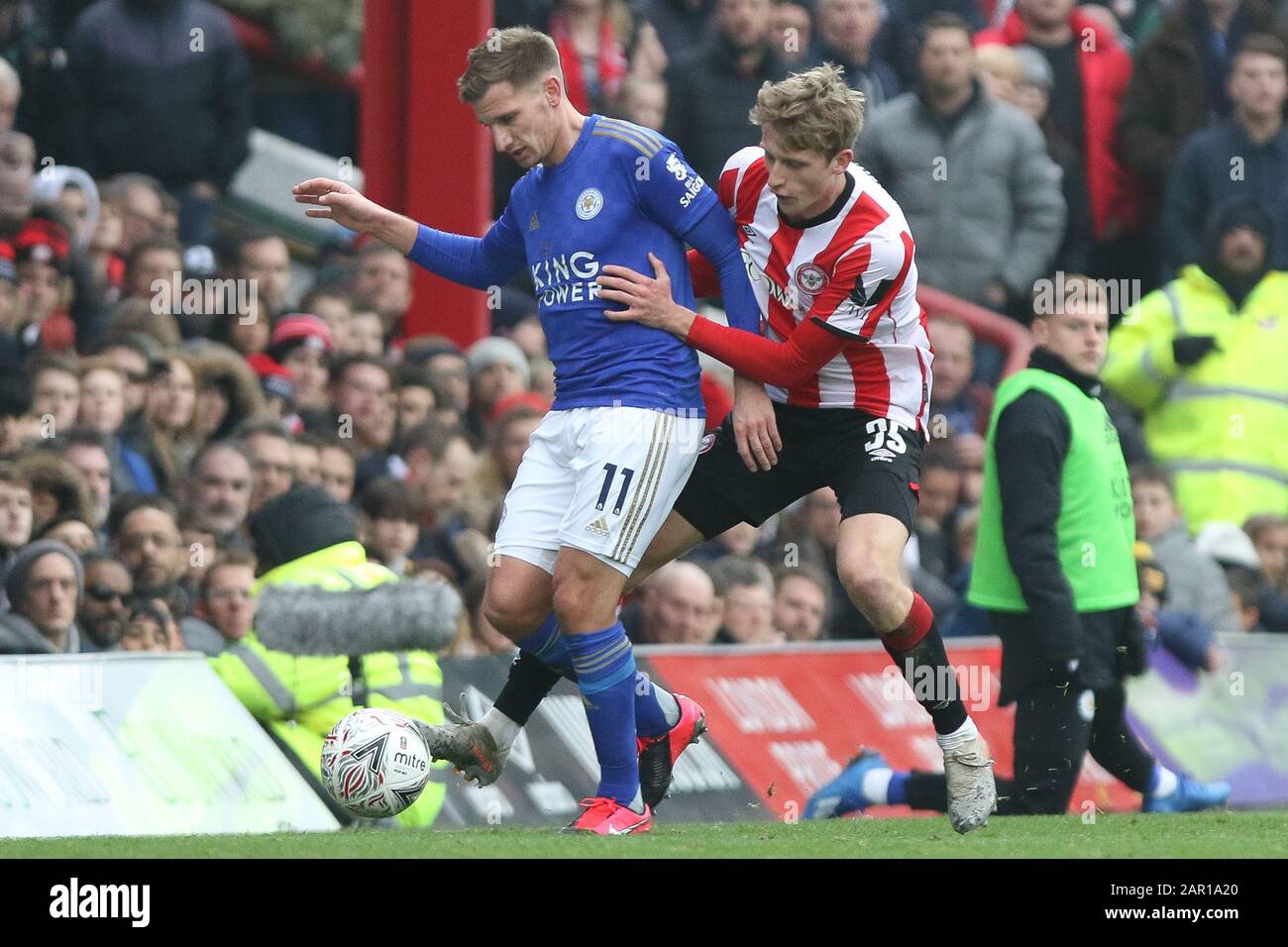 London, UK. 25 January 2020. BRENTFORD, LONDON - JANUARY 25TH Marc Albrighton of Leicester City holding off Mads Roerslev Rasmussen of Brentford during the FA Cup match between Brentford and Leicester City at Griffin Park, London on Saturday 25th January 2020. (Credit: Jacques Feeney | MI News) Photograph may only be used for newspaper and/or magazine editorial purposes, license required for commercial use Credit: MI News & Sport /Alamy Live News Stock Photo