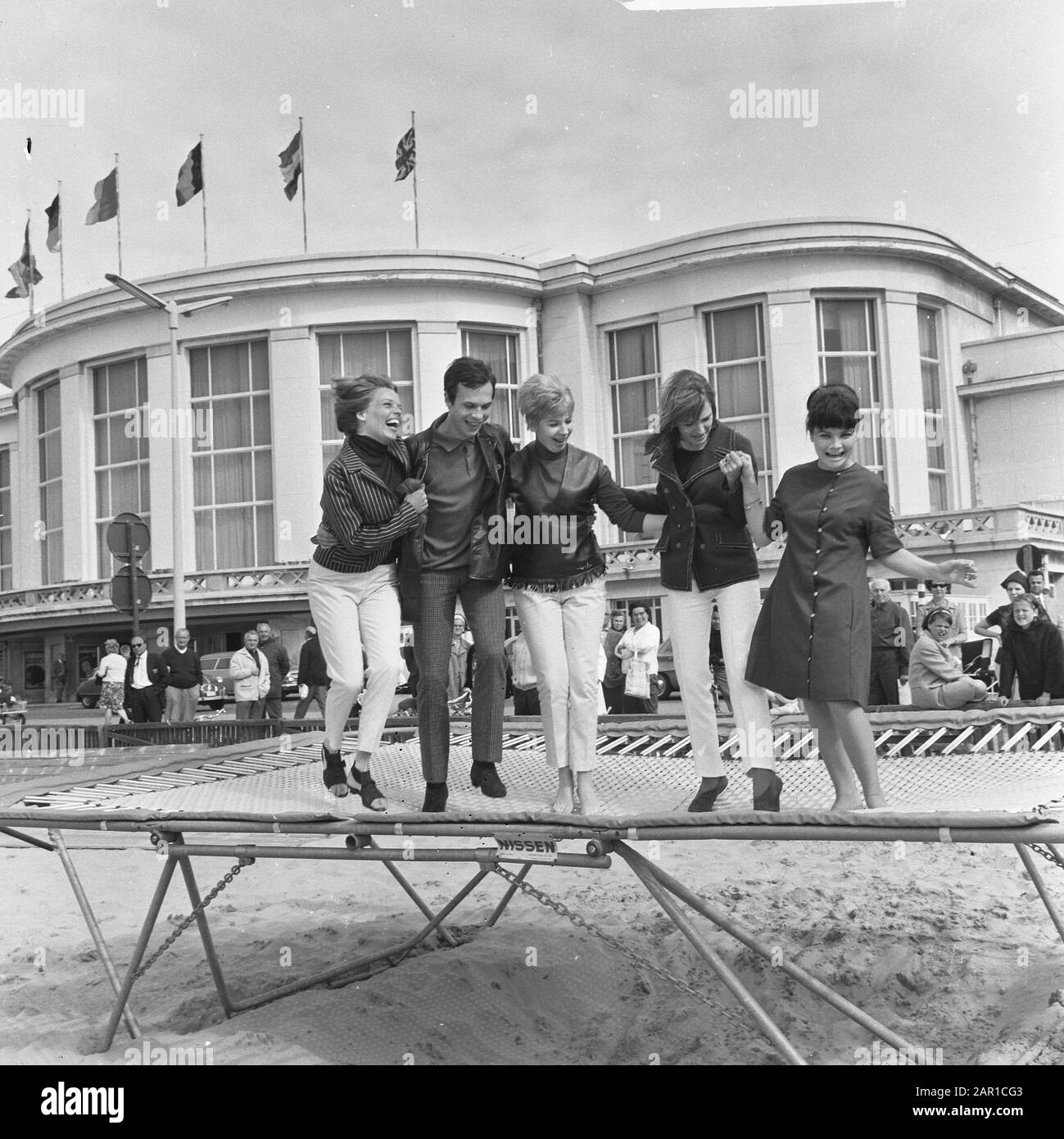 Seventh Europa Cup for Singing at Knokke, the singing team on the trampoline  at the beach Date: 10 July 1965 Location: Knokke Keywords: beaches, singers  Personal name: Europacup Stock Photo - Alamy