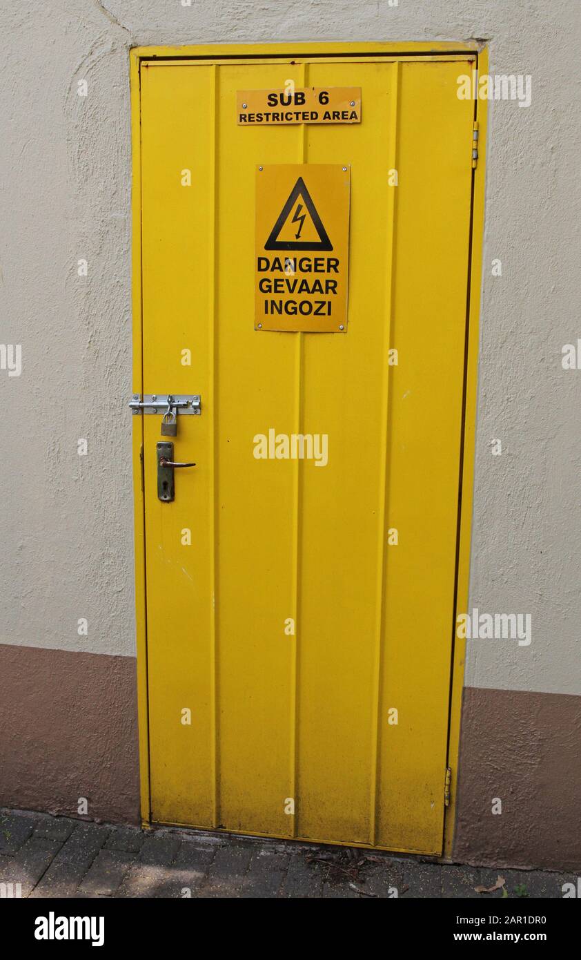 Door to sub level six restricted area with electric shock warning sign, Sanbonani Resort, Hotel & Spa, Hazyview, Sabie River, Kruger National Park, Mp Stock Photo