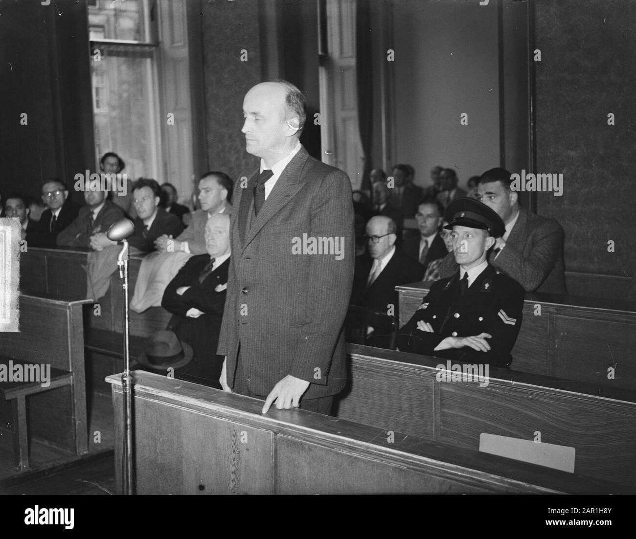 Willy Lages, former chief of the Amsterdam Sicherheitsdienst, during a session of the Special Court of Justice in Amsterdam Date: 19 July 1949 Location: Amsterdam, Noord-Holland Keywords: war criminals, lawsuits, World War II Personal name: Lages Willy Stock Photo