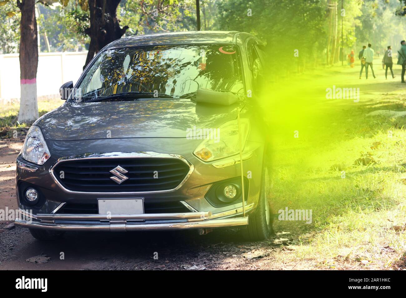 Car on the Way. Modern design parked on concrete road. Colorful New
