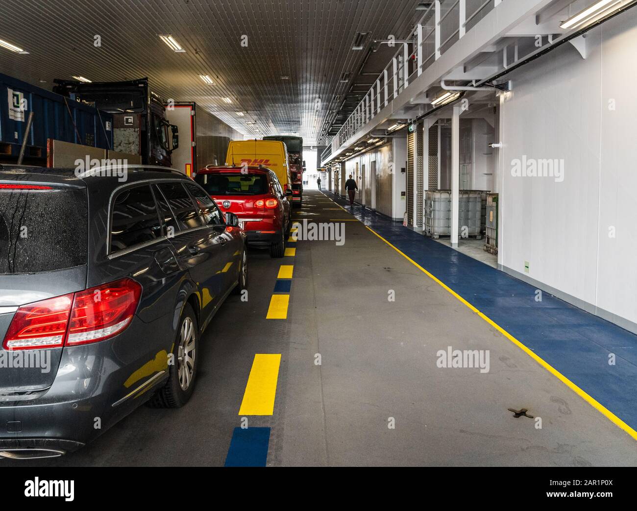 Editorial 09.03.2019 Halhjem Norway, Car deck of a car ferry with cars being transported from Halhjem to Sandvikvåg with one empty lane Stock Photo