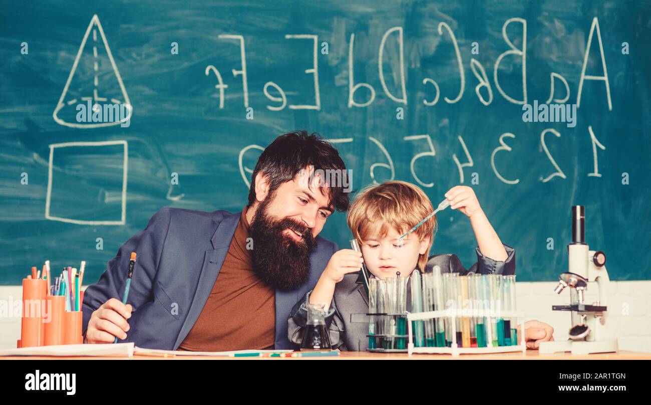 Wisdom. Back to school. son and father at school. Formula. experiments
