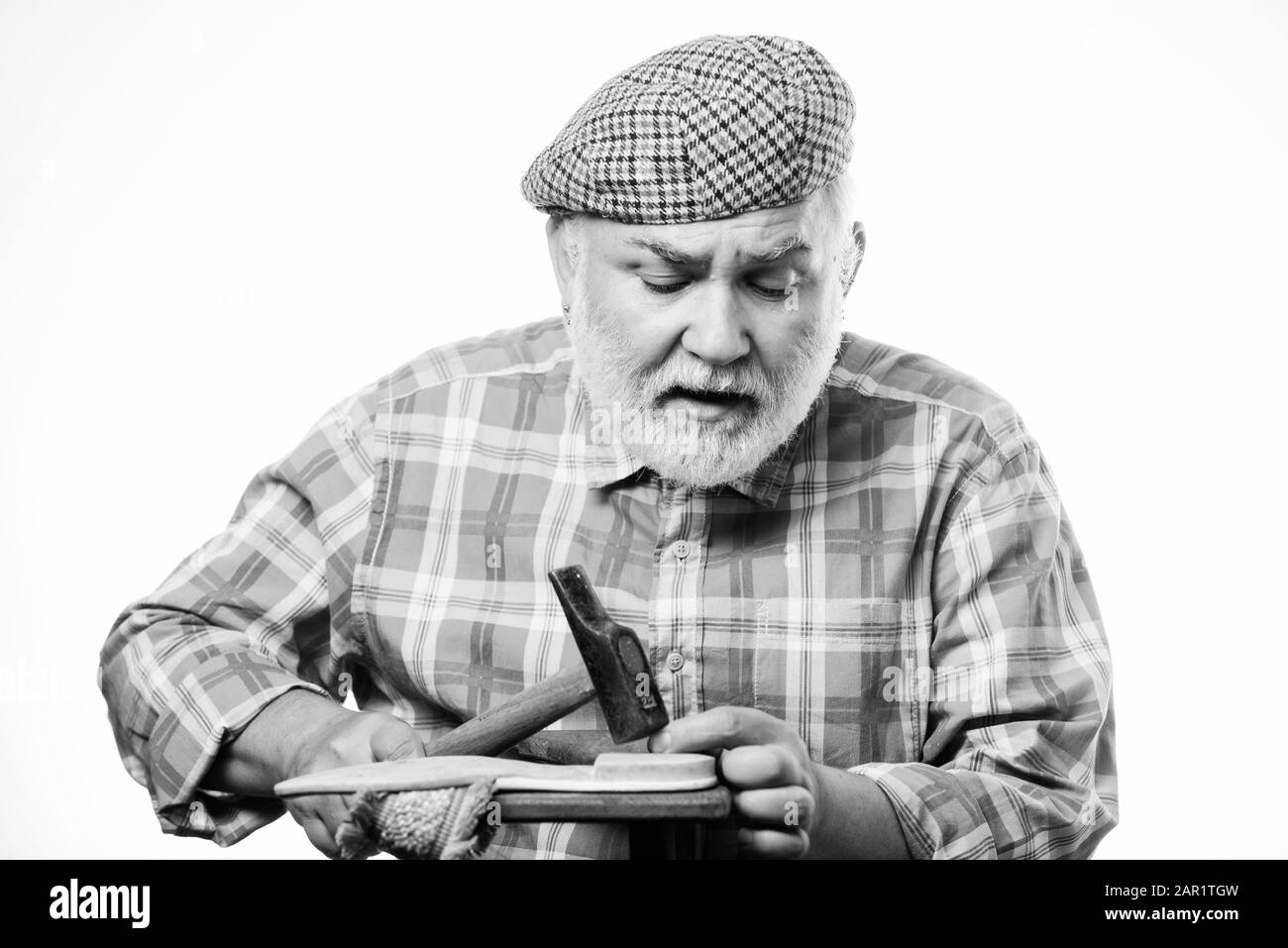 Man bearded handyman working with tools 