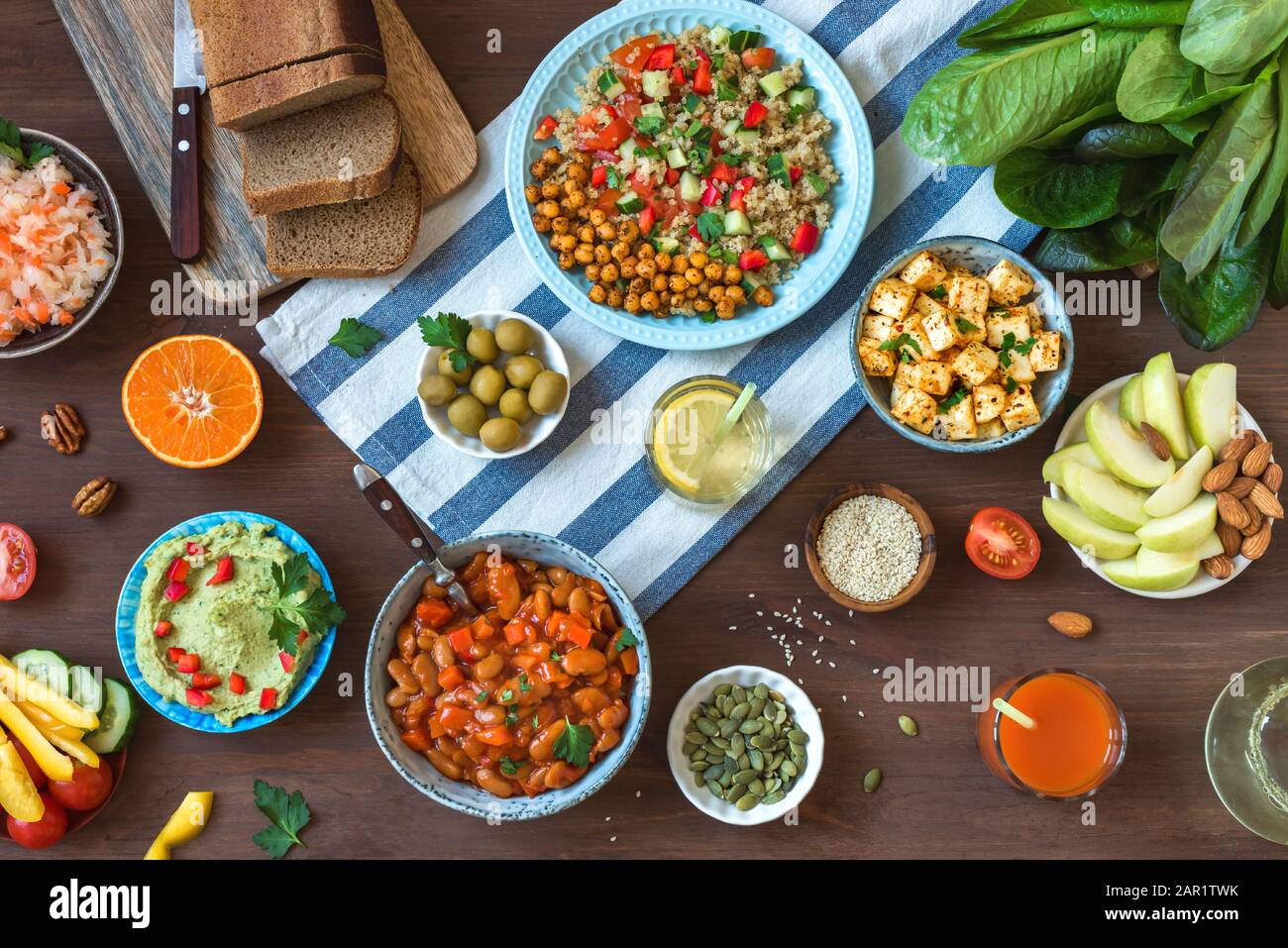 Vegan Dinner Table Set Of Healthy Vegan Vegetarian Dishes For Lunch Quinoa And Chickpea Salad Fried Tofu Hummus Dip Fruits Vegetables Nuts Se Stock Photo Alamy