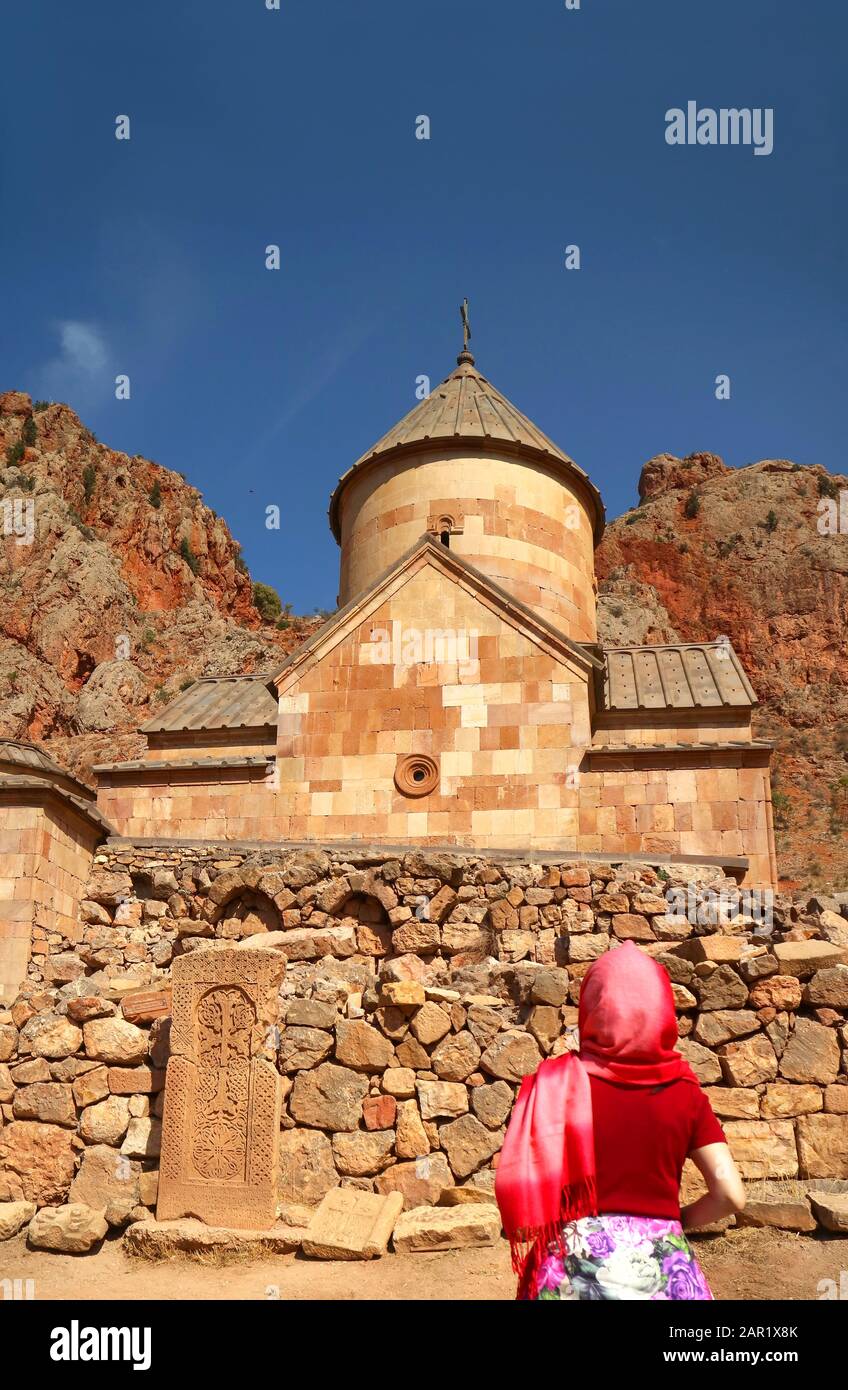 Female Visitor Admiring the Surb Karapet or St. John the Baptist Church at Noravank Monastery Complex, Armenia Stock Photo