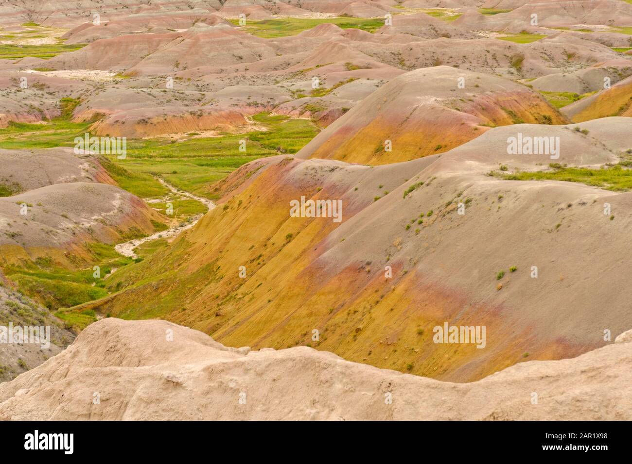 Colorful Sediments in the Badlands in Badlands National Park in South Dakota Stock Photo