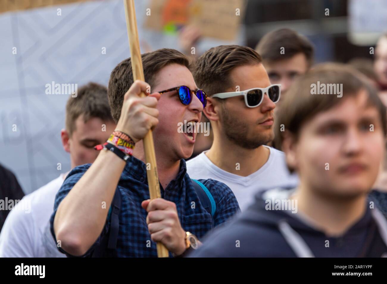 ERFURT, GERMANY - Mar 23, 2019: Young teenager man isolated shouting and holding sign at protest rally against new copyright law by European union, na Stock Photo