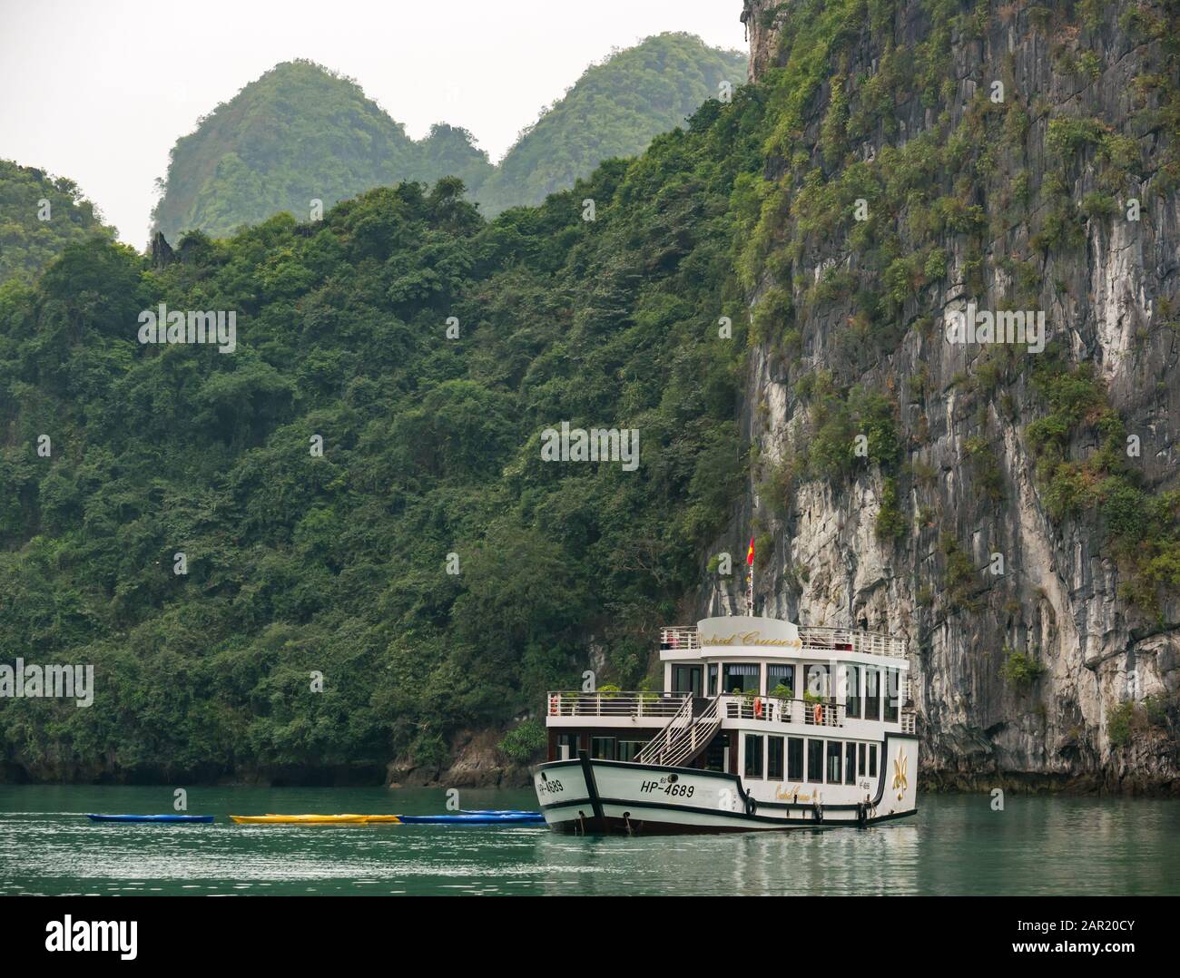Orchid Cruises day boat with kayaks, Cat Ba Island, Lan Ha Bay Vietnam, Asia Stock Photo