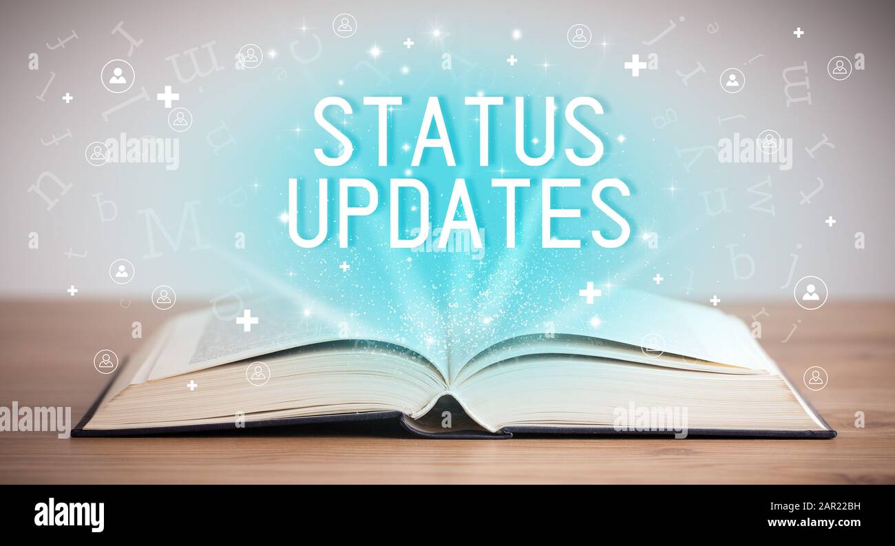 Open book with STATUS UPDATES inscription, social media concept Stock ...