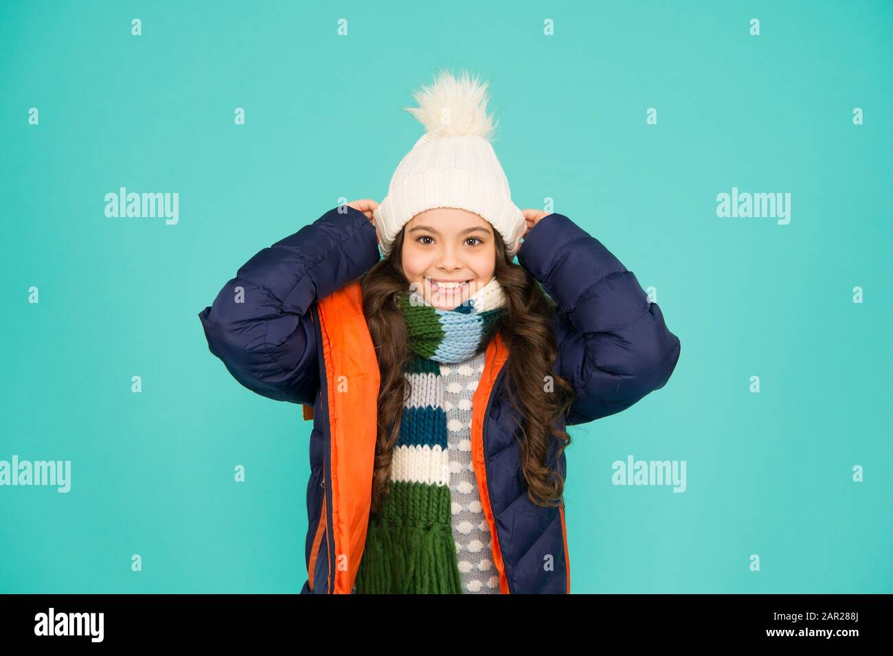 Cold season shopping. Child in padded warm coat. Seasonal fashion