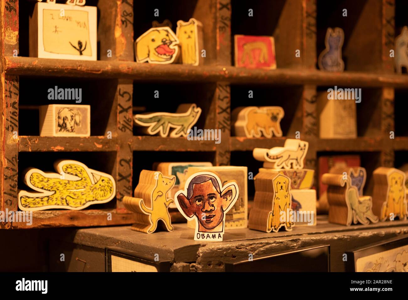 https://c8.alamy.com/comp/2AR28NE/artsy-wooden-blocks-for-sale-including-one-of-with-a-caricature-barack-obama-inside-fishs-eddy-a-tchotchke-store-on-broadway-in-manhattan-2AR28NE.jpg