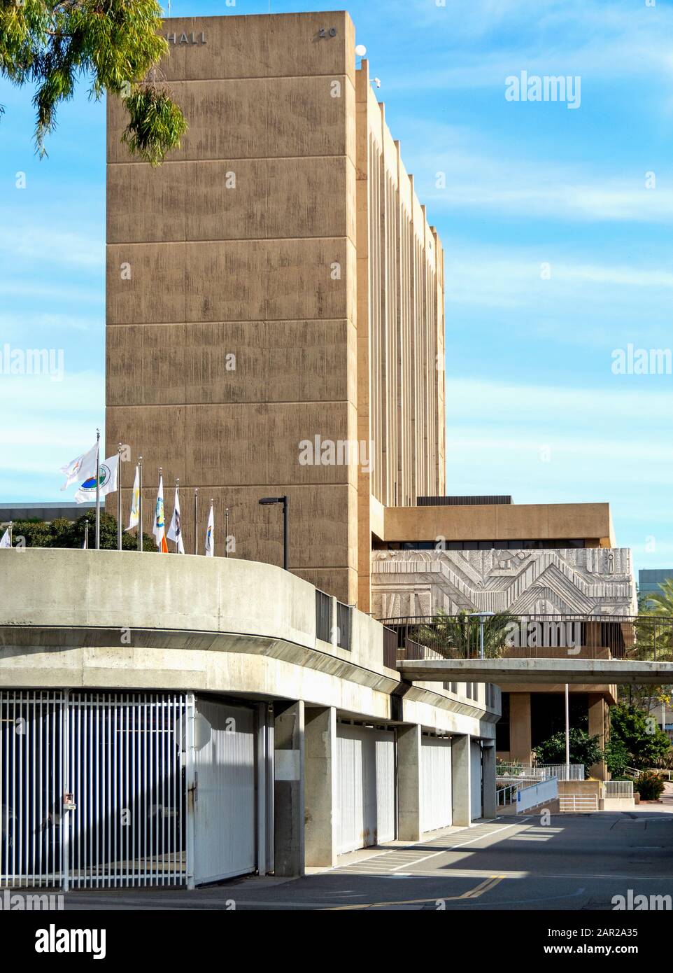 Santa Ana's New City Hall, a monolith of raw concrete built in the modern International style in the 1970's, is decorated with a carved stone border. Stock Photo
