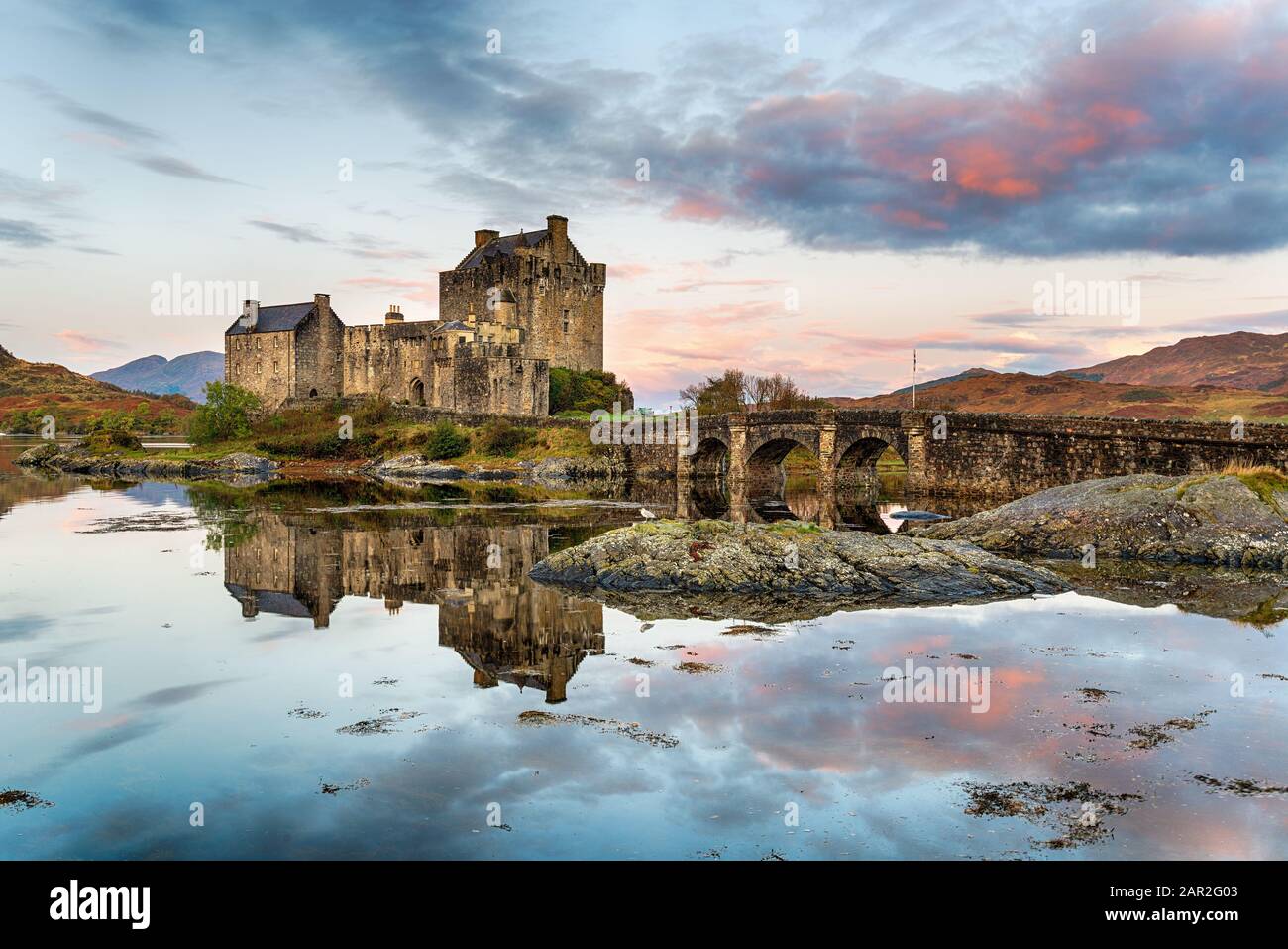 Sunrise Over Eilean Donan Castle Reflected In The Still Waters Of The sunrise-over-eilean-donan-castle-reflected-in-the-still-waters-of-the