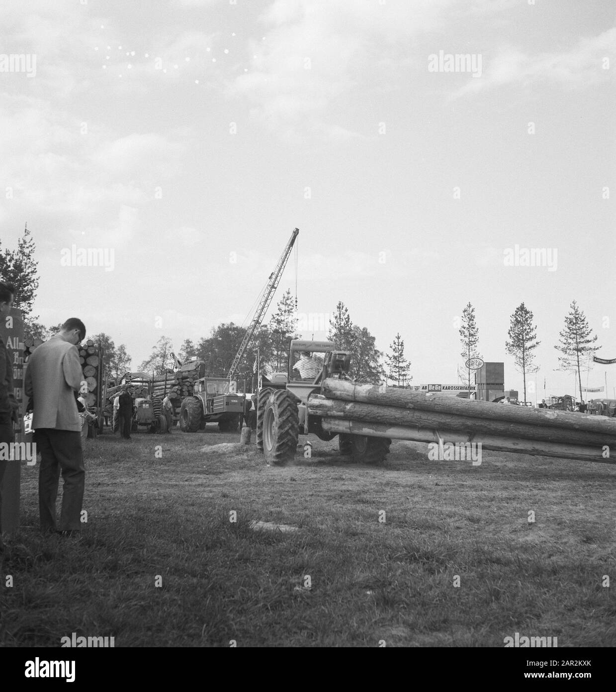 machines, tools, logs, workers Date: undated Keywords: workers, logs, machines, tools Stock Photo