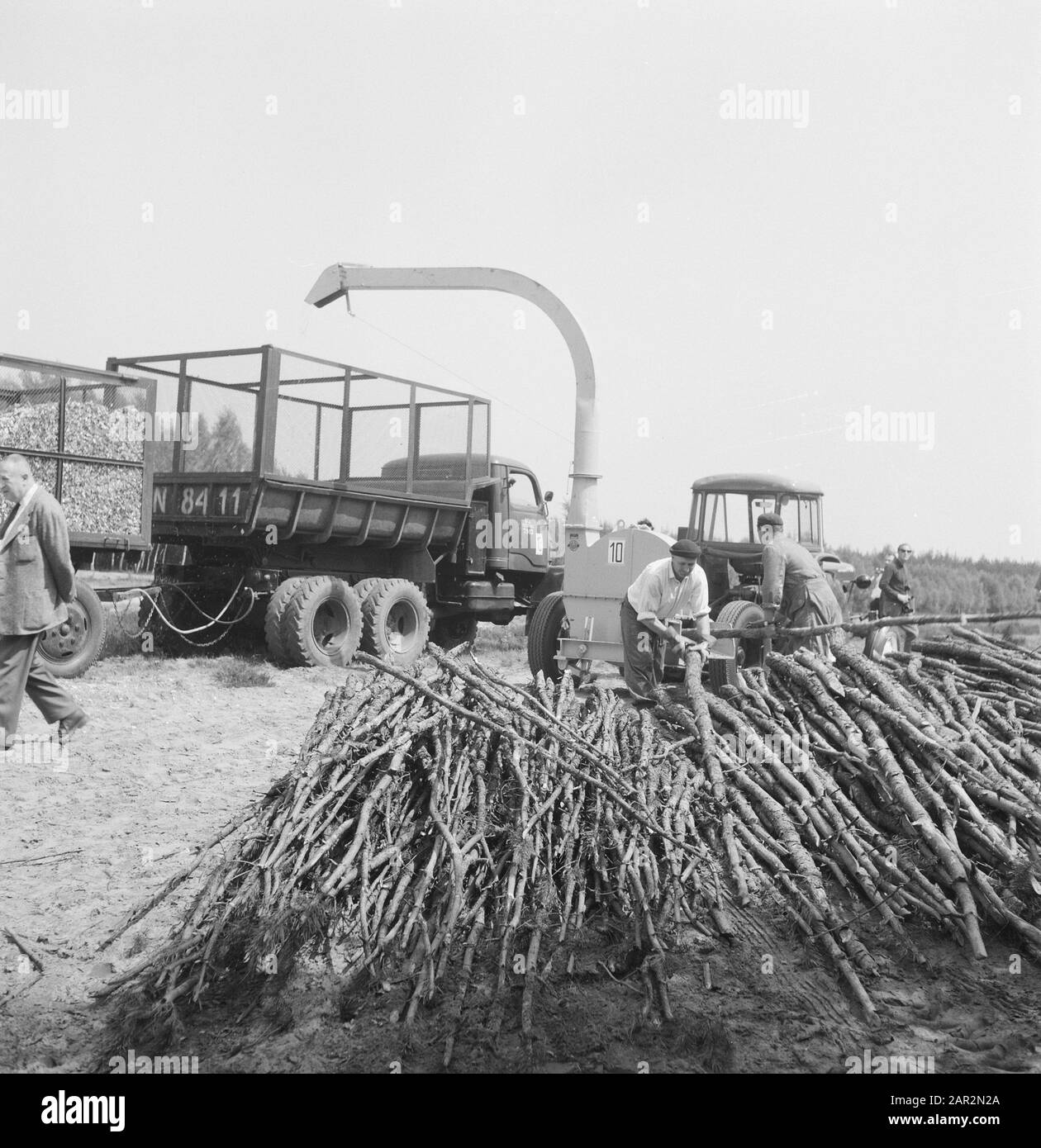 machines, tools, logs, workers Date: undated Keywords: workers, logs, machines, tools Stock Photo